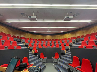 this image shows work to a lecture hall with celling mounted projectors and speakers